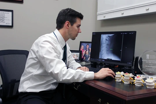 Chiropractor Cordova TN Jared Wootton At Desk